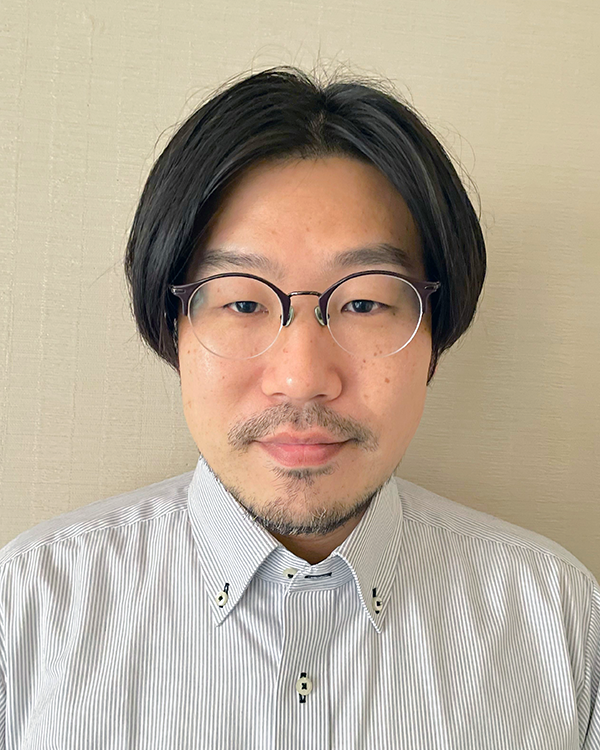Portrait photo of a man with glasses and striped shirt, used as a speaker image for the Felissimo solution case study on the AWS Japan website.