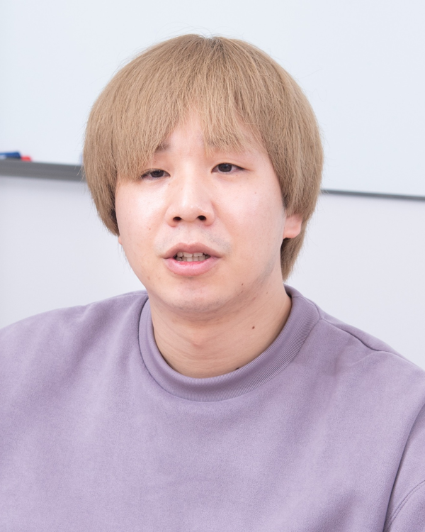 Portrait photograph of a person in a light purple top, used for Carta Holdings AWS solution case study.