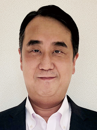 Portrait photo of a man in business attire, used for Sysmex case study on AWS Japan website.