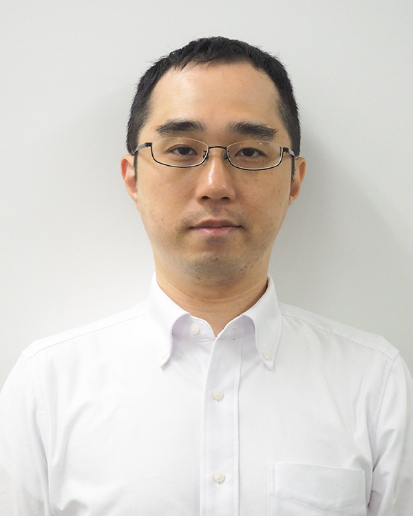 Portrait photo of a person in a white shirt with glasses, used for the Isehan case study.