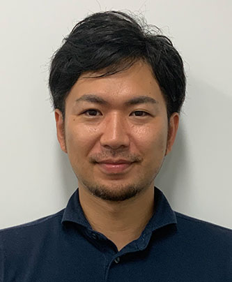 Portrait of a speaker, Taguchi Kenta, for the Doshishia case study, shown against a plain background.