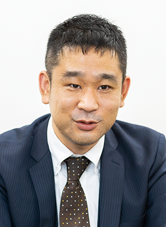Business portrait photo of Mr. Nabasama from Aktio, wearing a suit and tie, facing the camera against a plain background.