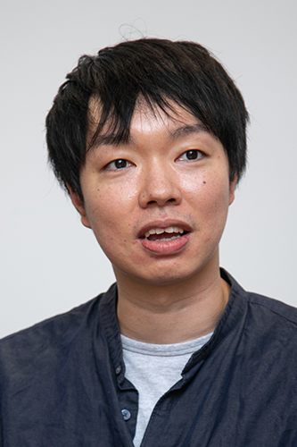 Portrait photograph of an individual from NetProtections against a plain background.