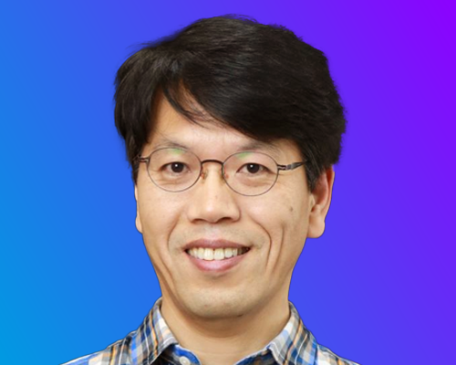 A person wearing a blue and white plaid shirt against a gradient blue and purple background.