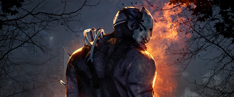 A menacing killer character from Dead by Daylight stands with their back turned, partially illuminated by flames in the background, creating an intense and dramatic scene.