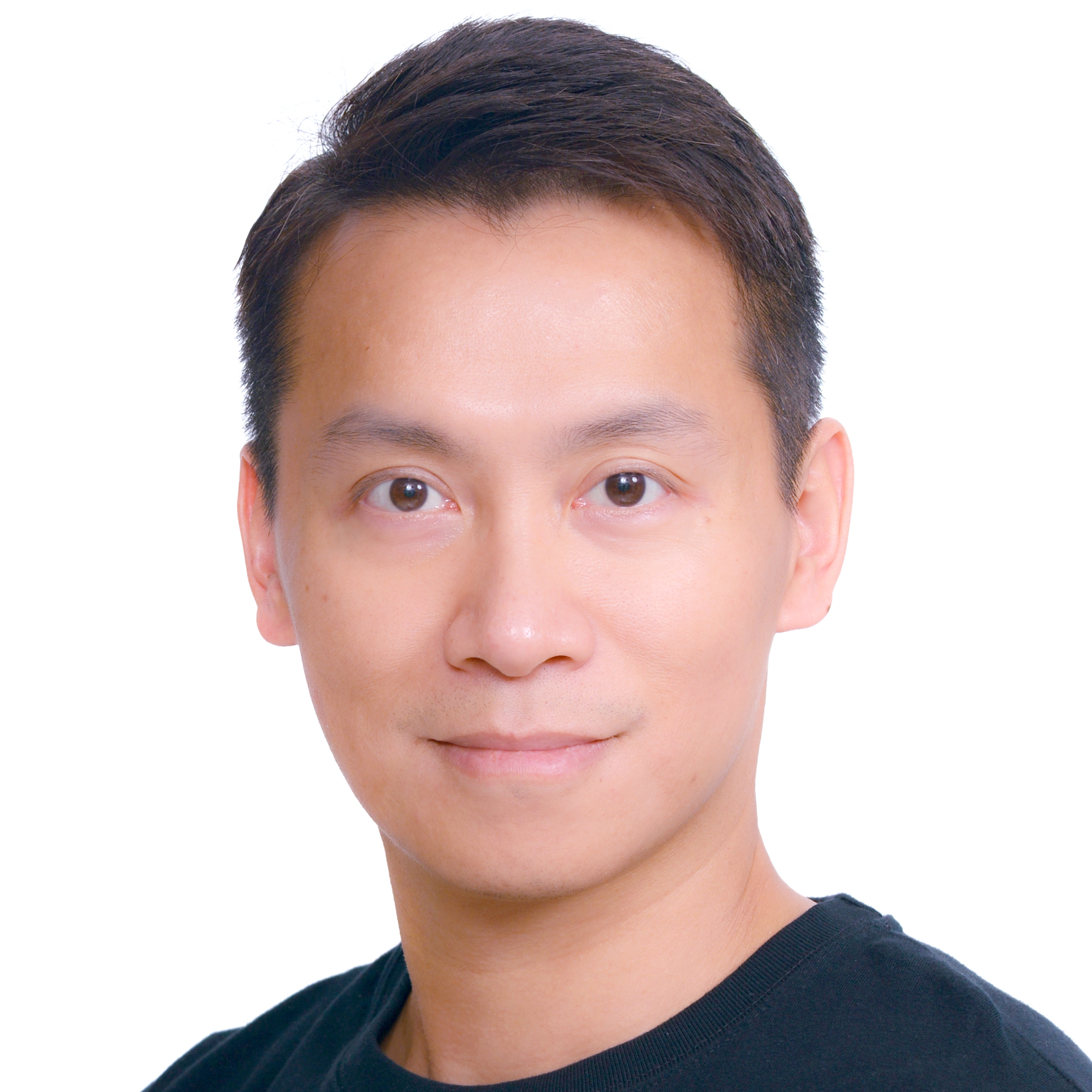 A professional studio headshot of a man in front of a plain white background, suitable for use in event or business promotional materials.