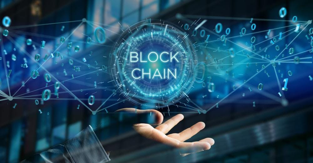 A visual representation of blockchain technology, featuring a digital network with binary code and interlinked nodes emitting from a central 'BLOCK CHAIN' holographic interface above an outstretched hand.