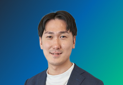 A person wearing a white shirt and dark blazer against a blue-to-green gradient background.