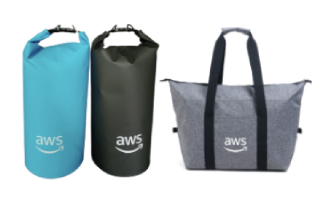 Three AWS branded bags are shown: two roll-top waterproof dry bags (one blue, one black) and one gray tote bag, each featuring the AWS logo.