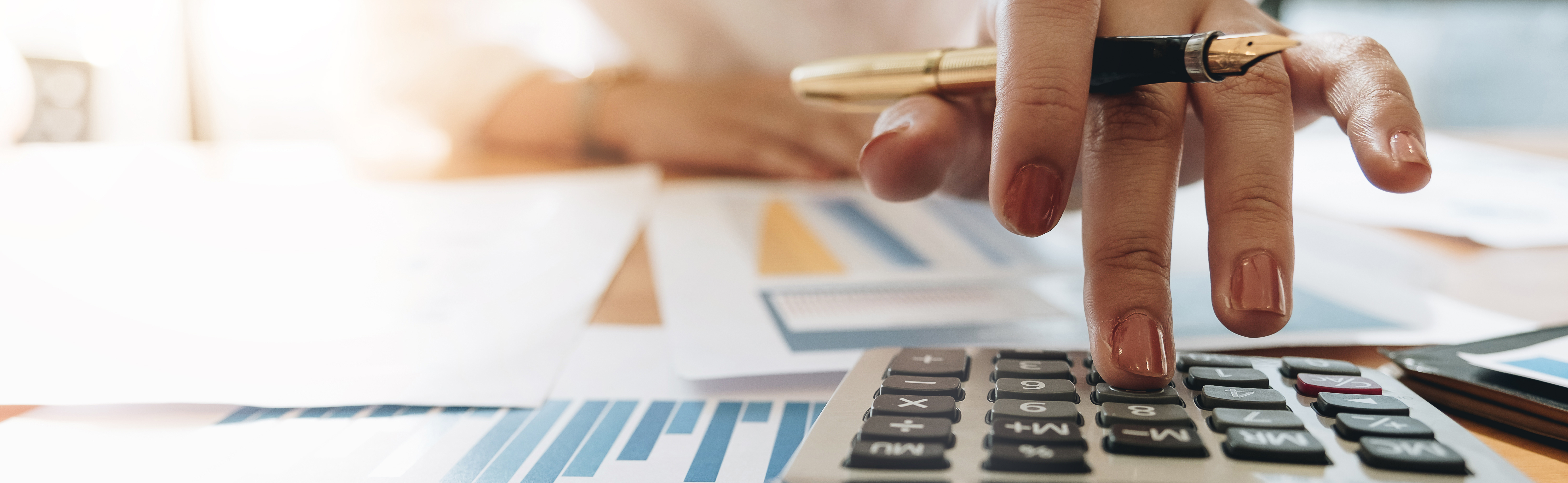 Close up Business woman using calculator and laptop for do math finance on wooden desk in office and business working background, tax, accounting, statistics and analytic research concept; Shutterstock ID 1108176035; purchase_order: AWS Executive Insights webpage; job: AWS Global Executive Marketing; Use Case: (internal materials or creative mockup): Enterprise Strategy Blog