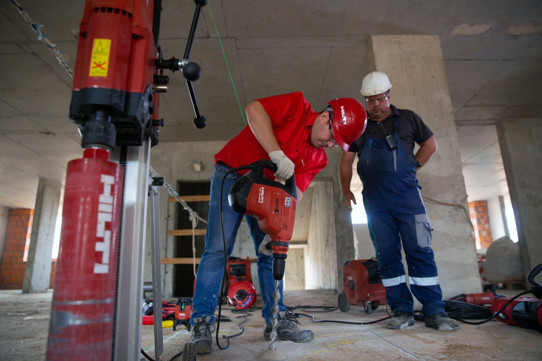Construction workers operating heavy equipment on job site demonstrating pre trained model applications for workplace safety and industrial monitoring