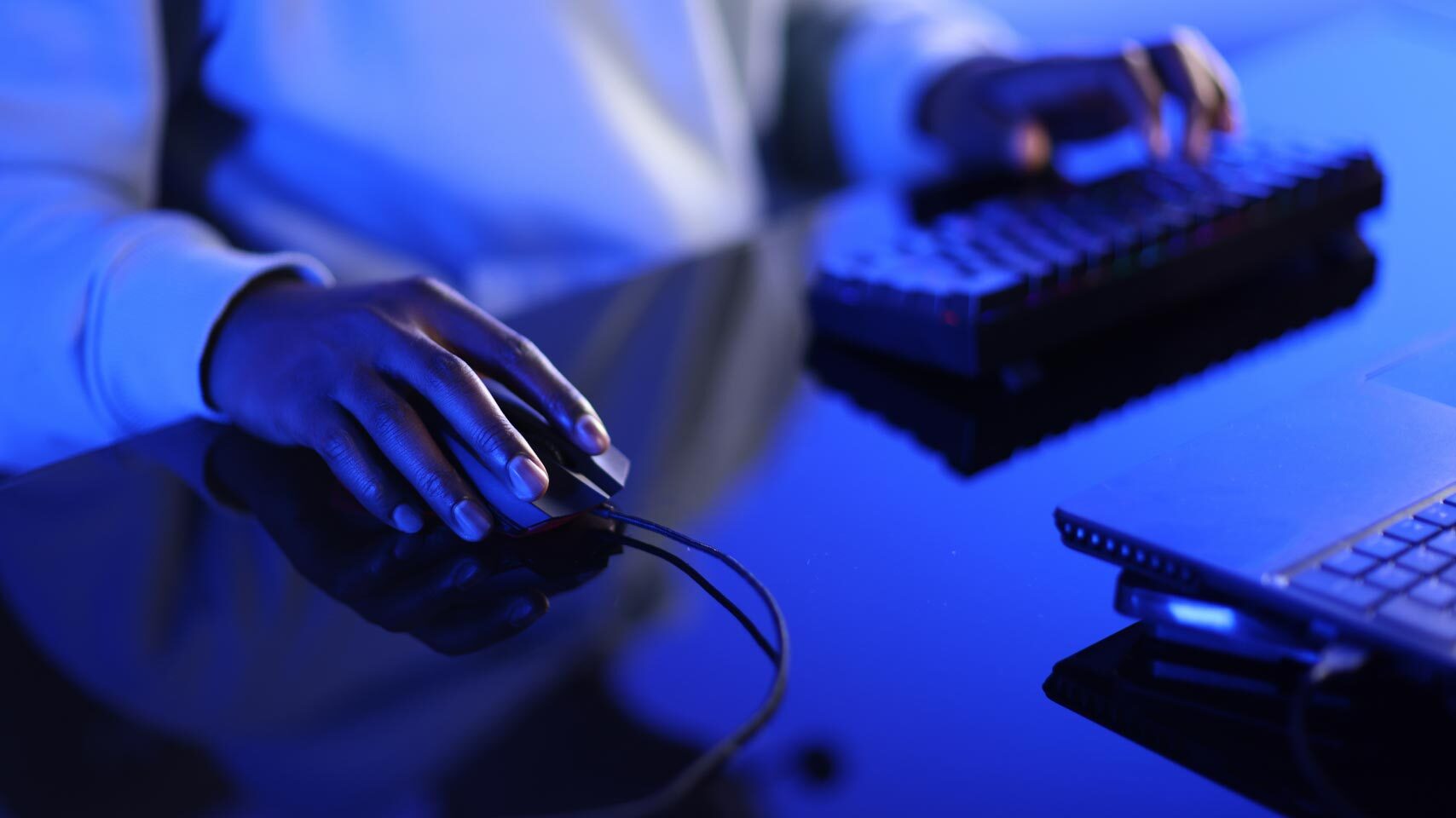 Image of a person’s hands while working on a PC