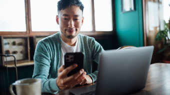 Person sitting down looking at phone