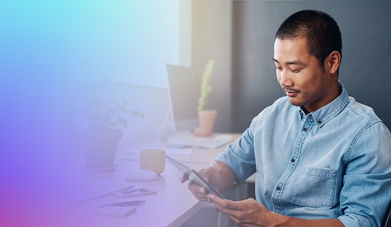 Man sitting with tablet in hands