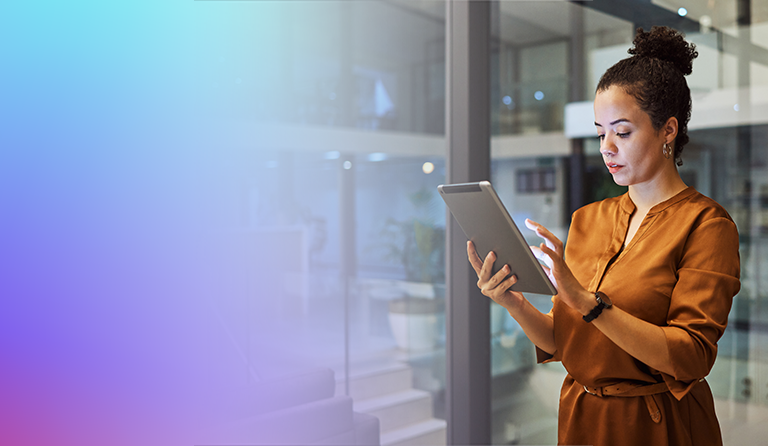 Woman standing with tablet in hands