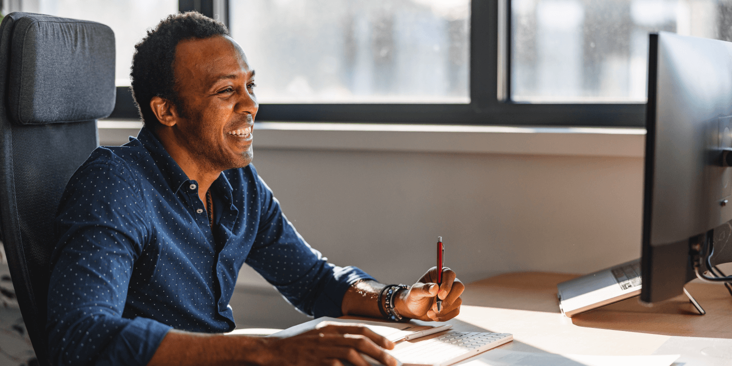 photo of man with computer