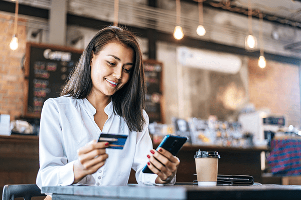 Photo of woman holding credit card