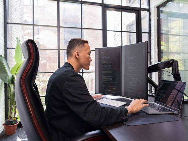 photo of man using computer